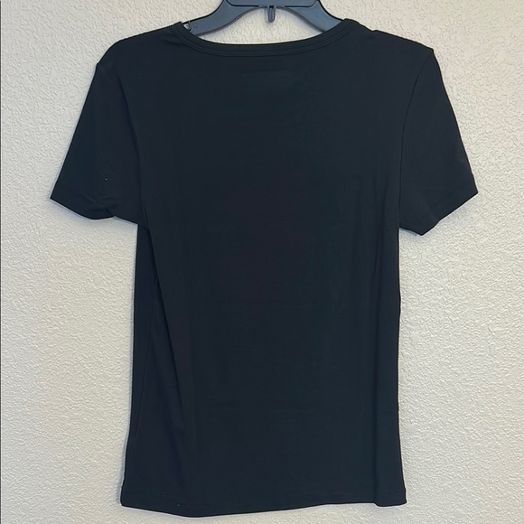 Women large Amazon tops in white and black. One top has a wider neckline. - Picture 7 of 14